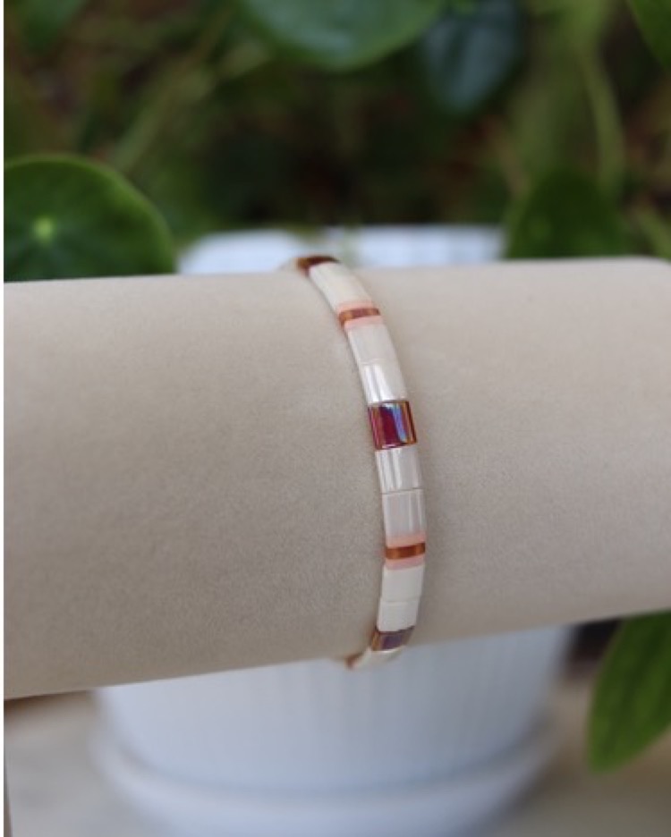 Paris bracelet showing pearl-white, blush, copper, and iridescent tiles