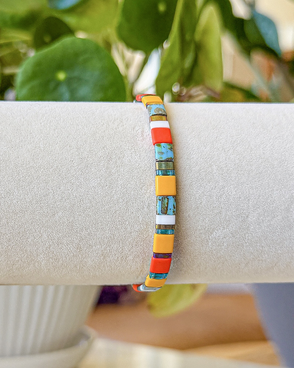 Bracelet close-up photograph in turquoise, coral, and golden tones