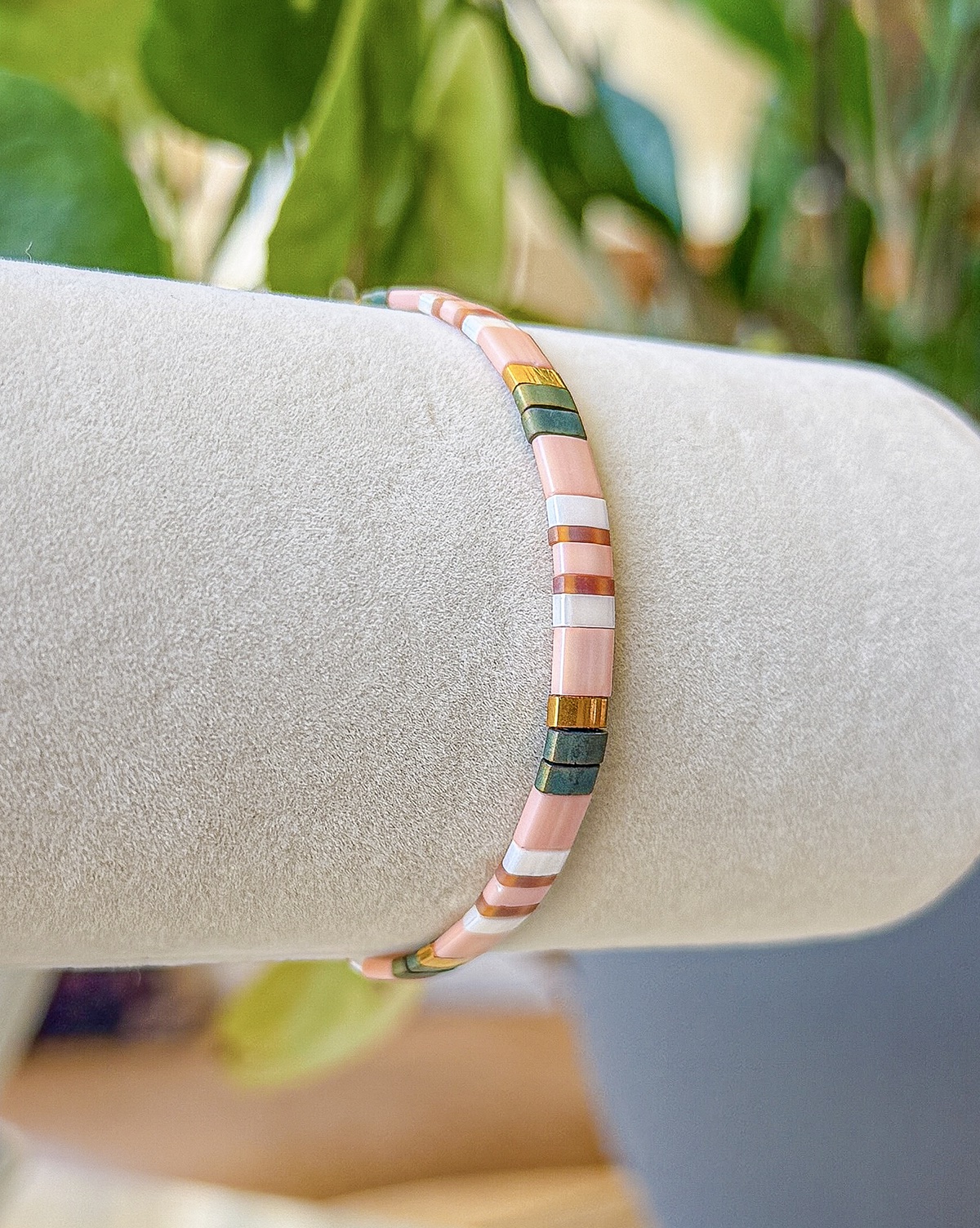 Bracelet close-up photograph with ivory and rose-toned tiles