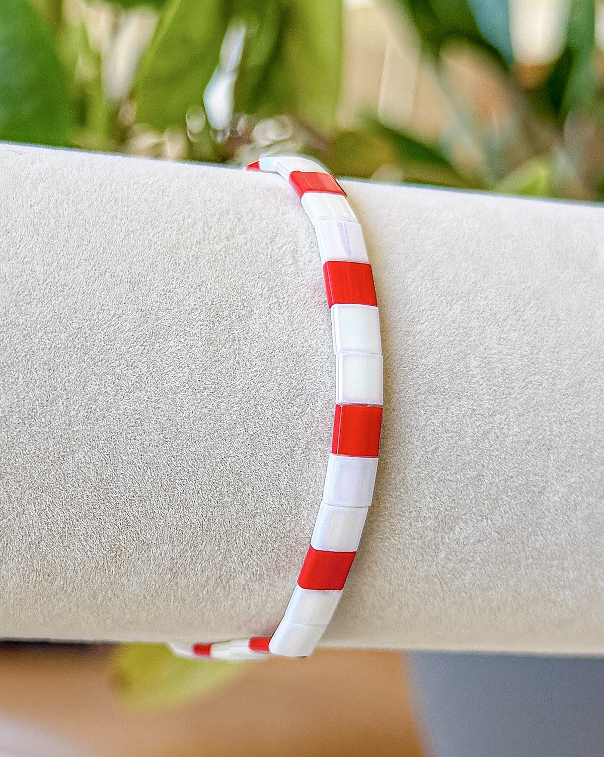 Monaco bracelet close-up photograph in clear red and pearl-white tones