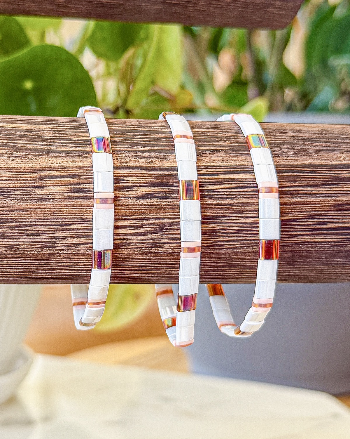 Bracelet close-up photograph in light neutral and gold tones