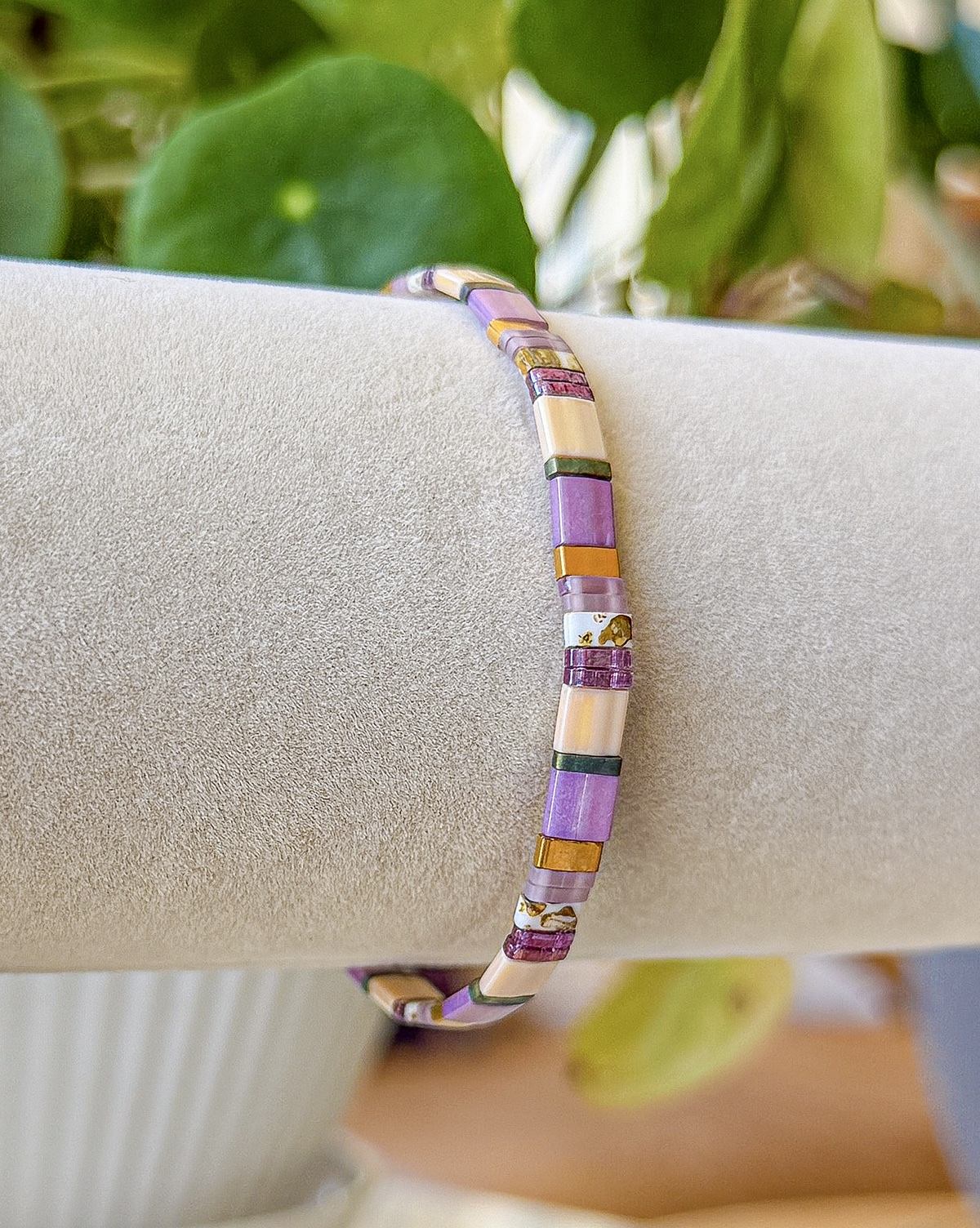 Vienna bracelet close-up photograph in violet, lilac, pearl, and bronze tones
